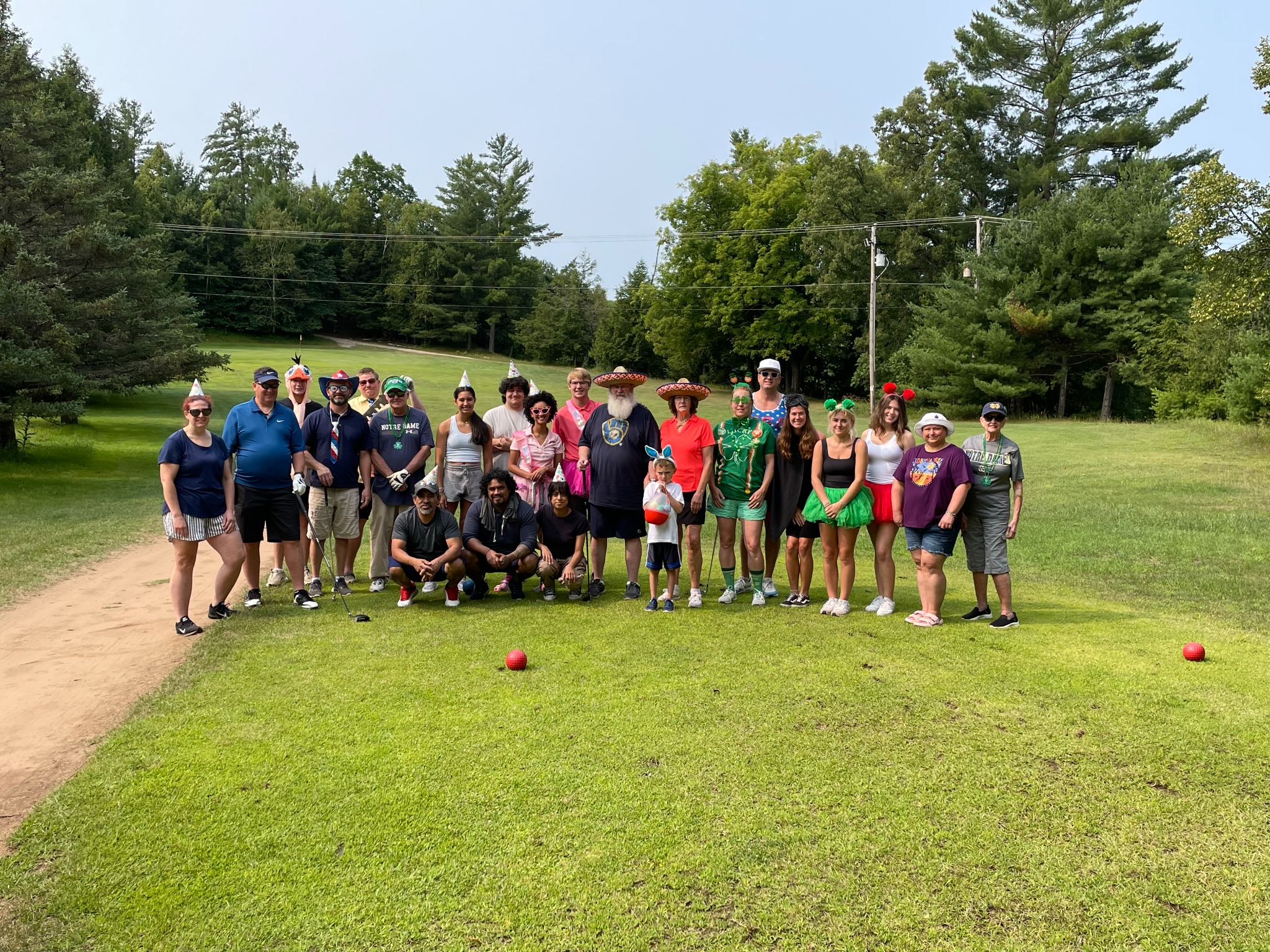 A large group of golfers out together on the course
